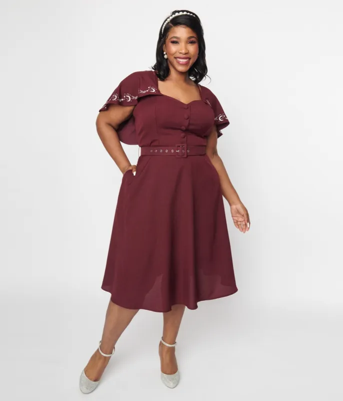 Unique Vintage 1970s Eggplant & Moon Embroidered Capelet Swing Dress sold by Unique Vintage