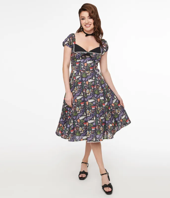Unique Vintage 1950s Black Spellbinding Print Swing Dress sold by Unique Vintage