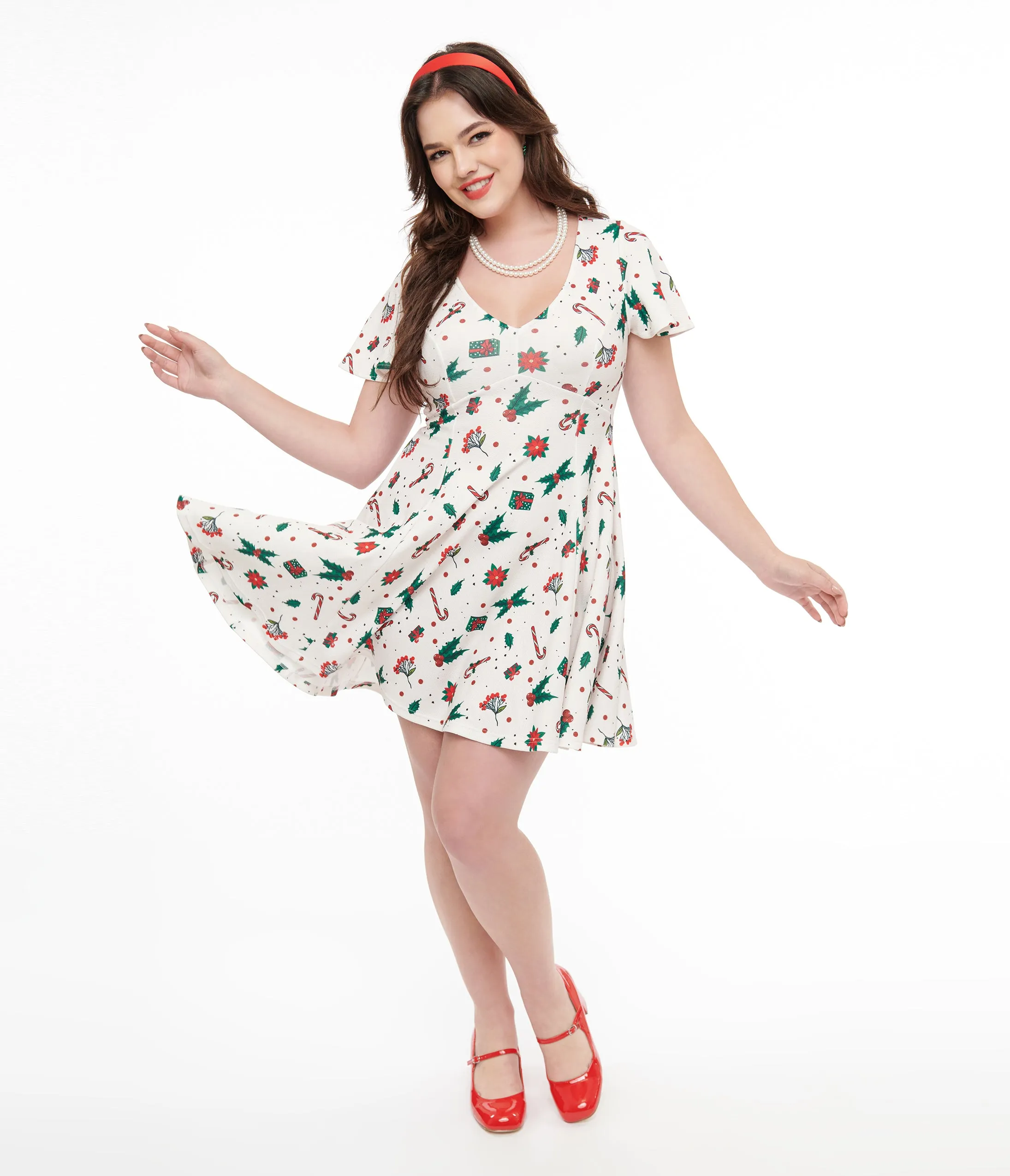 Unique Vintage 1950s Ivory Christmas Print Poppy Flare Dress sold by Unique Vintage