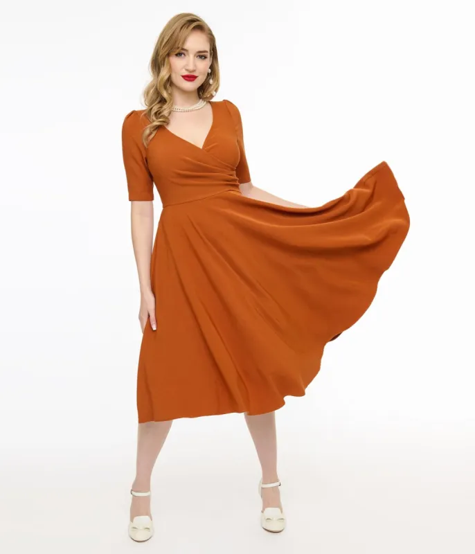 Voodoo Vixen 1950s Orange Wrapover Swing Dress sold by Unique Vintage
