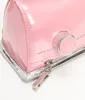 Betsey Johnson Pink Iron Crossbody Bag sold by Unique Vintage