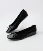 1960s Black Patent Leatherette Bow Flats sold by Unique Vintage