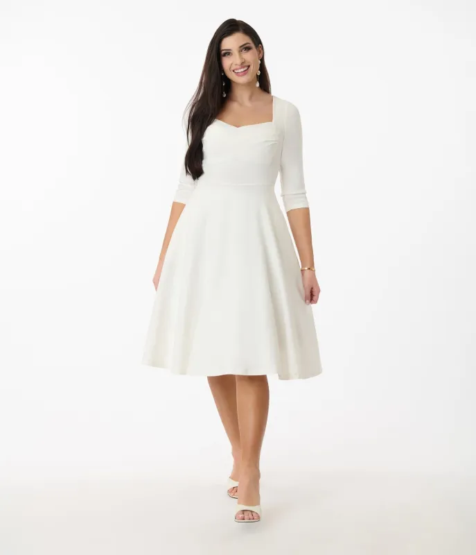 Unique Vintage 1950s Ivory Pleated Bust Swing Dress sold by Unique Vintage