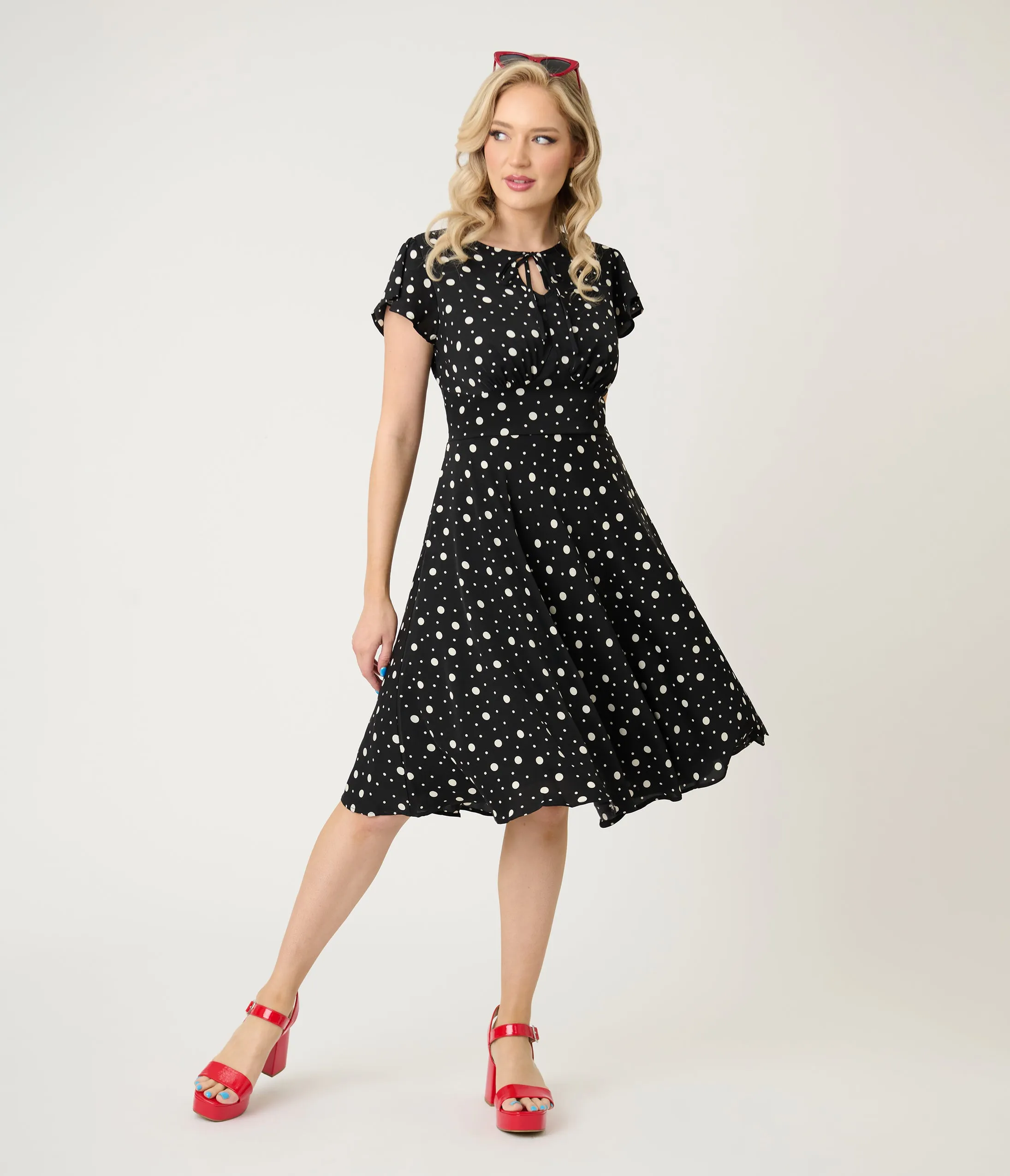 Voodoo Vixen Black & White Polka Dot Flutter Sleeve Fit & Flare Dress sold by Unique Vintage
