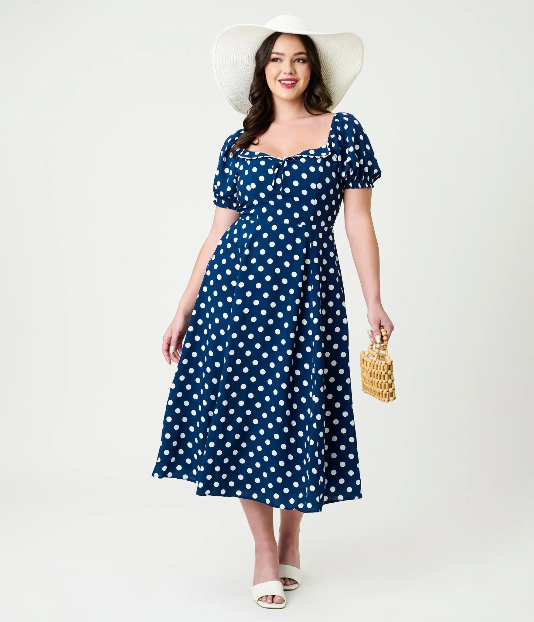 Unique Vintage Navy & White Dot Puff Sleeve Midi Dress sold by Unique Vintage