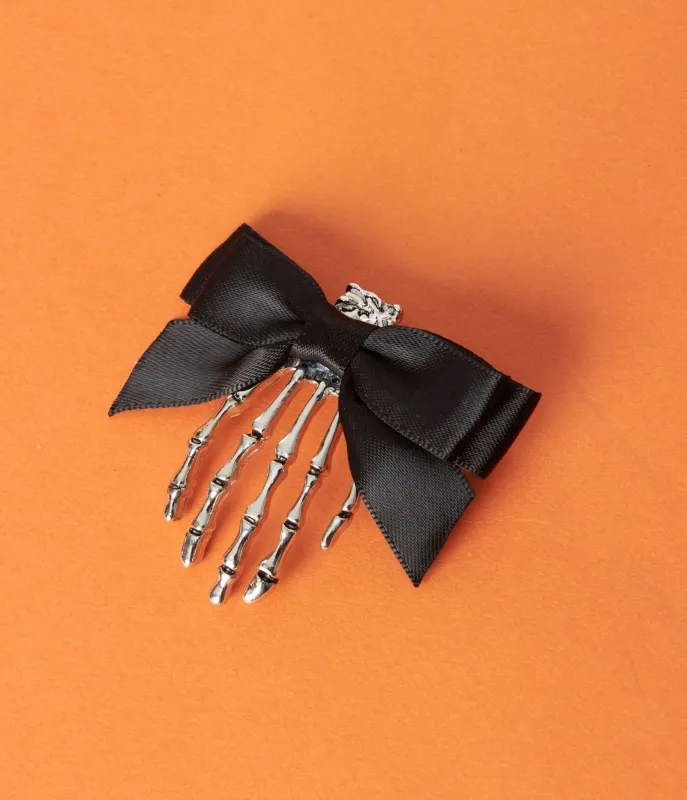 Silver Skeleton Hand & Black Bow Hair Clip sold by Unique Vintage