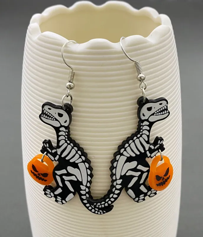 Trick-or-Treat Skeleton Dinosaur Earrings sold by Unique Vintage