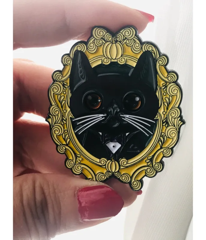 Black Sliding Eye Cat Enamel Pin sold by Unique Vintage
