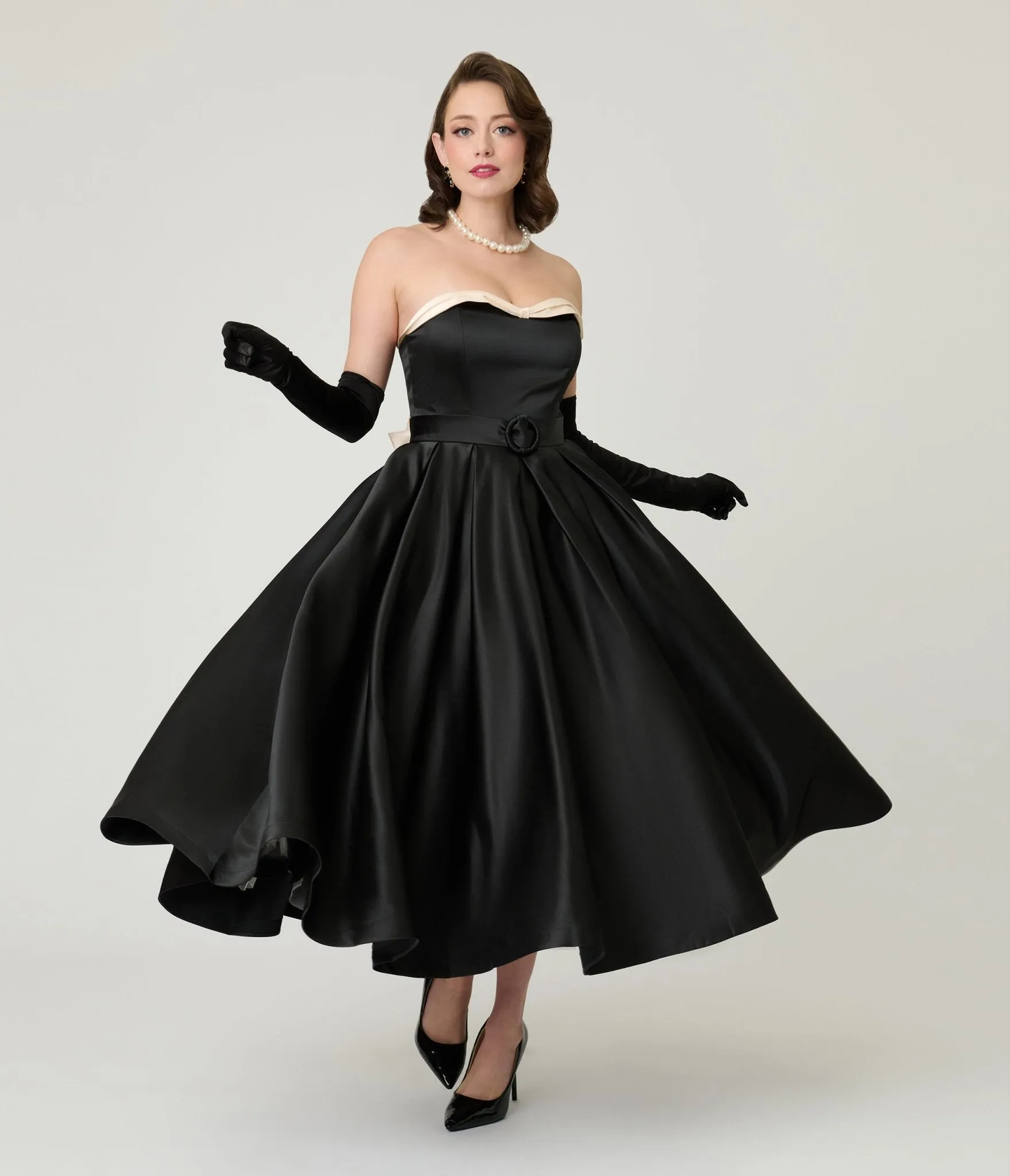 Unique Vintage Black Strapless Tea Length Gown sold by Unique Vintage
