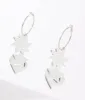 Silver Mirror Acrylic Magic Hoop Earrings sold by Unique Vintage