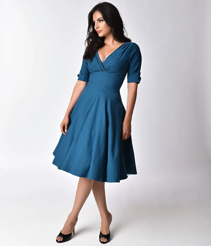 Unique Vintage 1950s Teal Delores Swing Dress with Sleeves sold by Unique Vintage