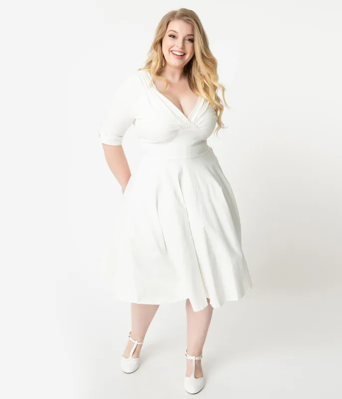 Unique Vintage Plus Size 1950s Ivory Delores Swing Dress with Sleeves made by Unique Vintage