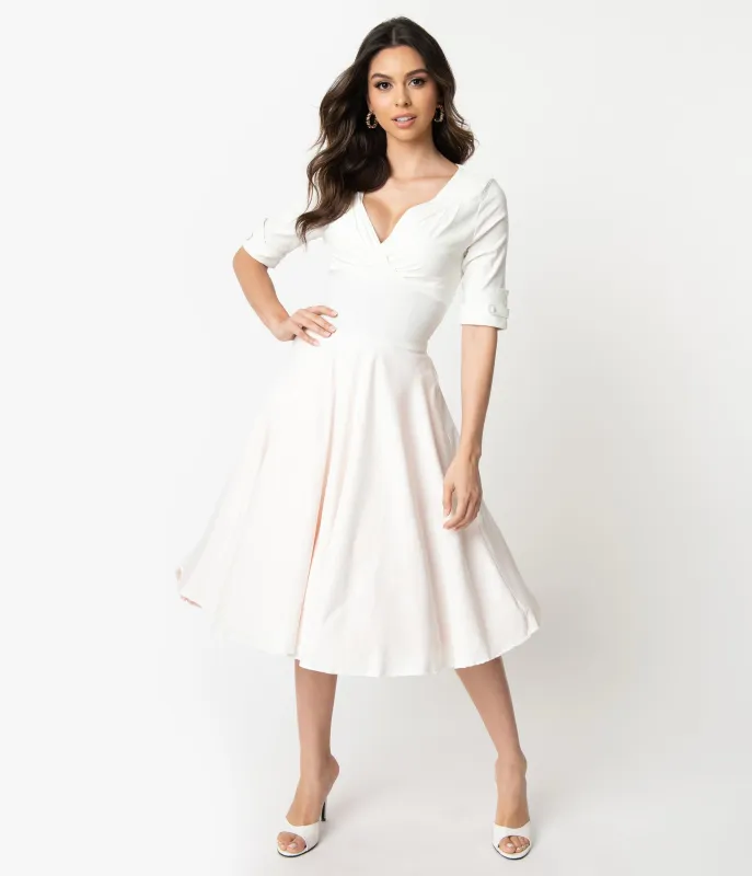 Unique Vintage Ivory Delores Swing Dress with Sleeves made by Unique Vintage