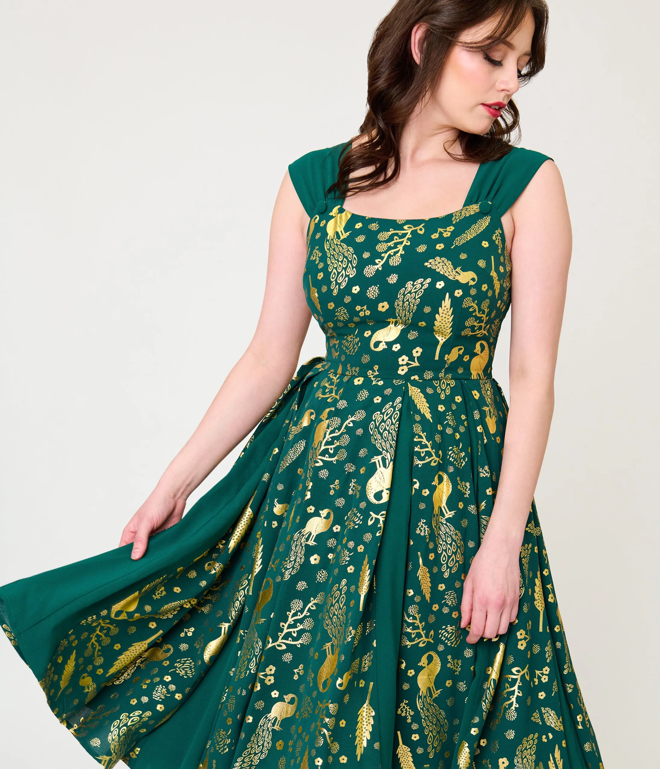 Unique Vintage Green & Gold Peacock Swing Dress sold by Unique Vintage