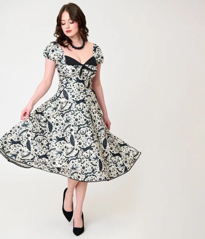 Unique Vintage Ivory & Black Mystical Cat Print Swing Dress made by Unique Vintage