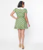 Smak Parlour 1960s Green Floral Smocked Fit & Flare Dress sold by Unique Vintage