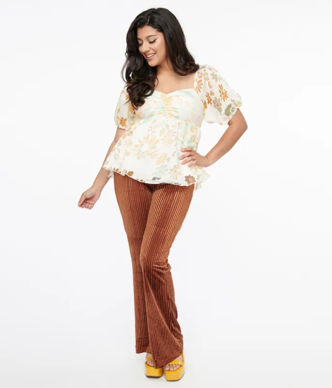 1970s Rust Rhinestone Velvet Flared Pants sold by Unique Vintage