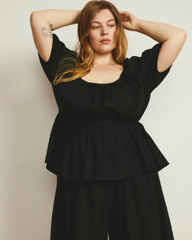Andrea Peplum Linen Top - Black made by Universal Standard