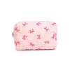 Bow & Tell Cosmetic Pouch sold by Urban Expressions