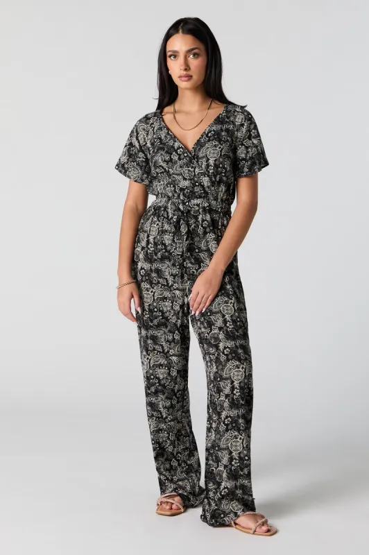 Printed Surplice Belted Jumpsuit sold by Urban Planet