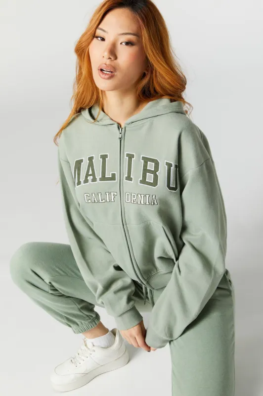 Haut à capuchon en chemille avec motif brodé Malibu et fermeture à glissière sold by Urban Planet