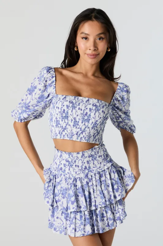Minijupe volantée smockée fleurie bleue sold by Urban Planet