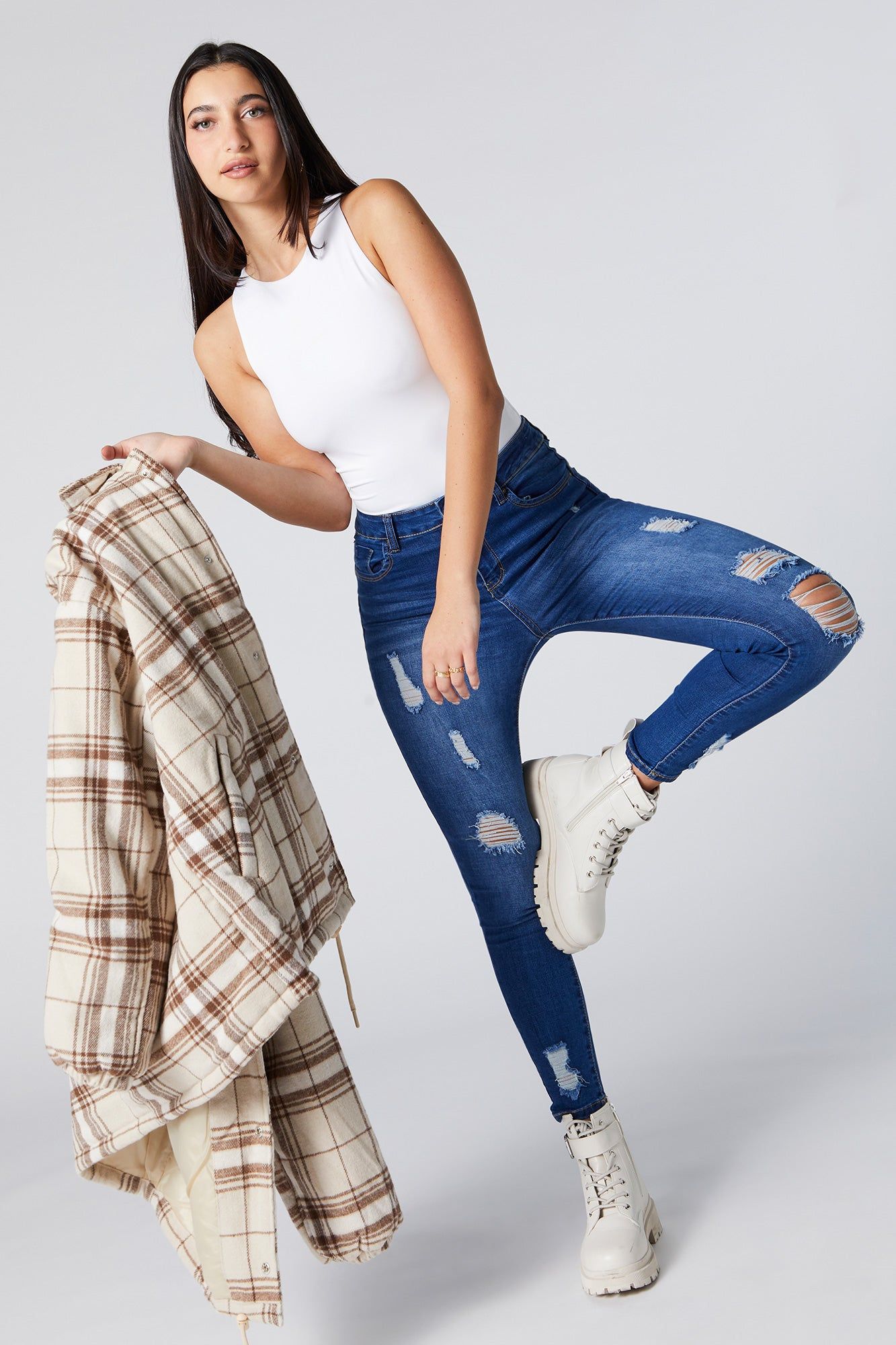 Medium Wash Distressed High Rise Skinny Jean sold by Urban Planet