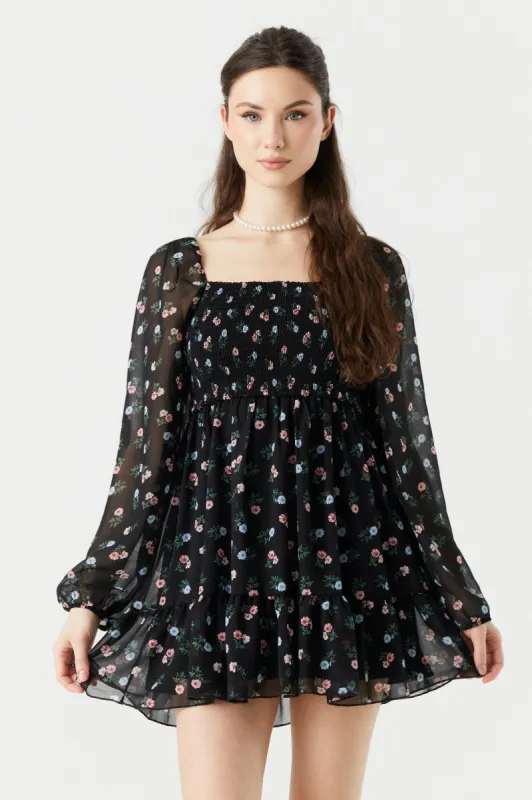 Minirobe smockée fleurie noire à manches longues sold by Urban Planet