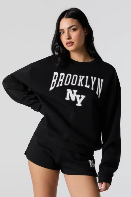 Brooklyn Chenille Embroidered Fleece Sweatshirt sold by Urban Planet