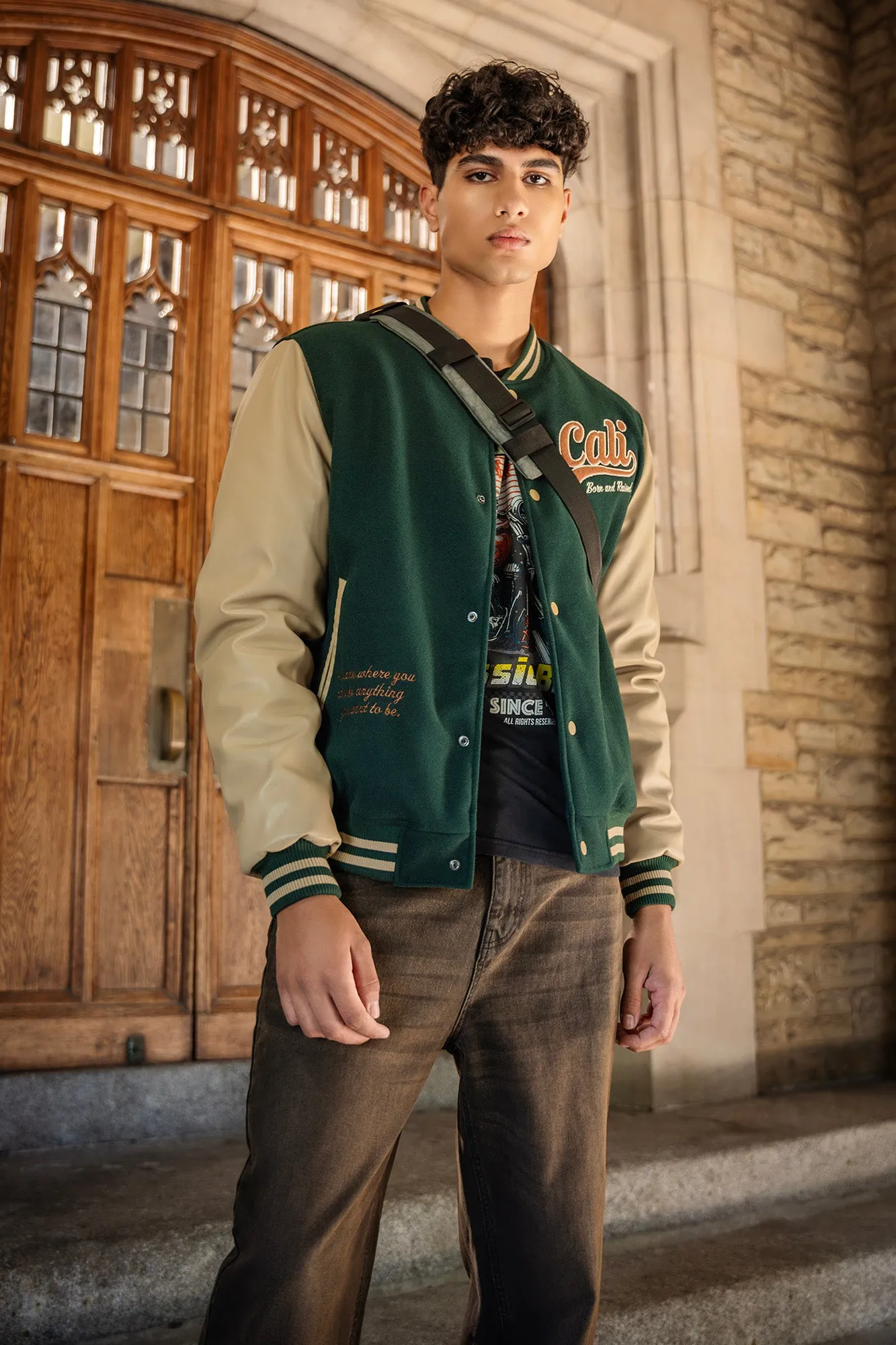 Blouson de style universitaire avec manches en similicuir et motif brodé sold by Urban Planet