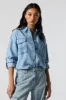 Haut boutonné en denim sold by Urban Planet