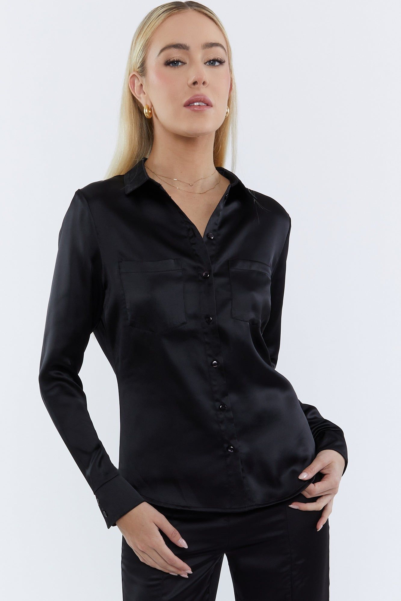 Chemise boutonnée en satin noir sold by Urban Planet