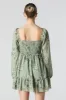 Minirobe smockée fleurie à manches longues sold by Urban Planet