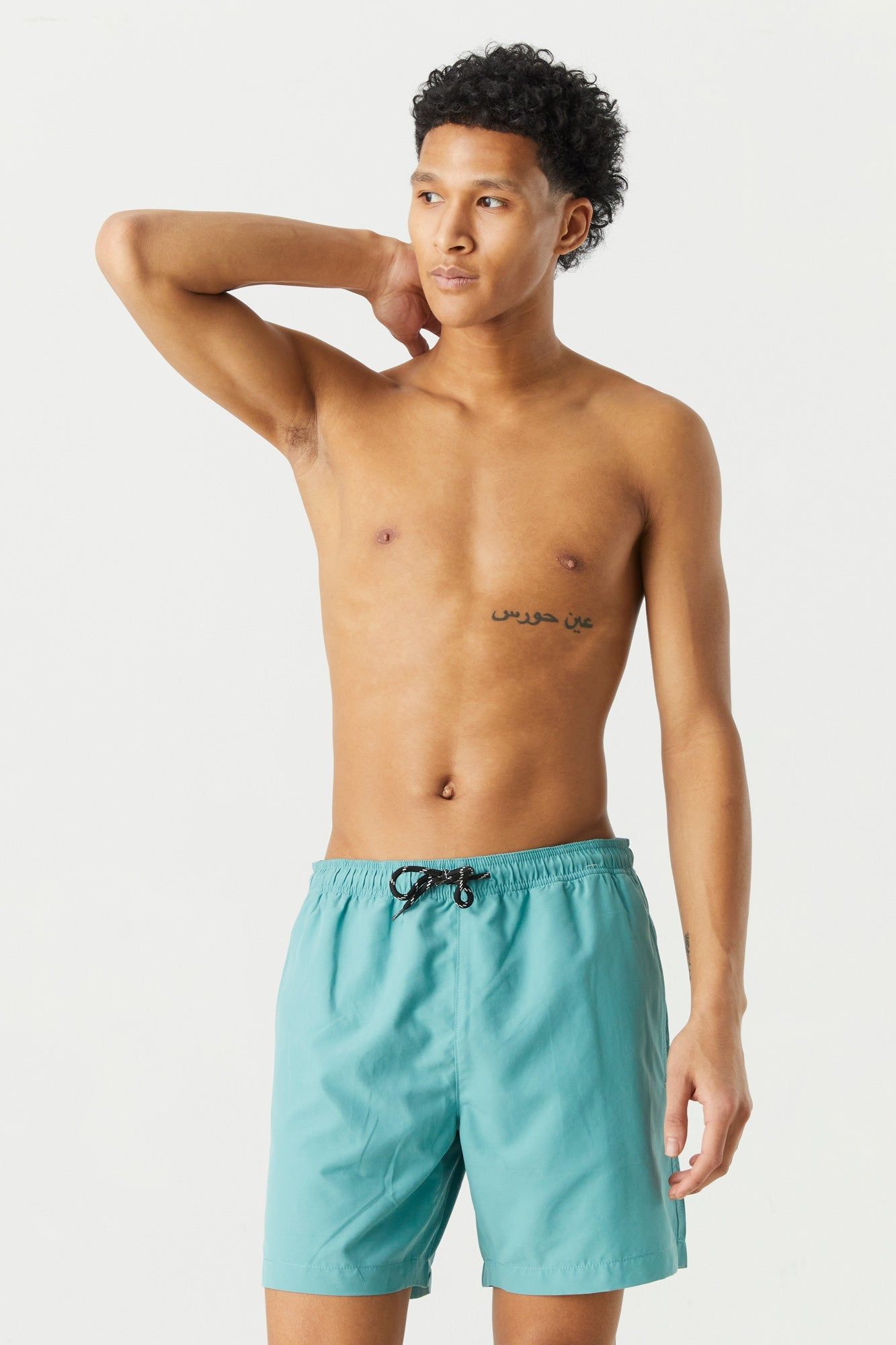 Short de surf uni coloree sold by Urban Planet