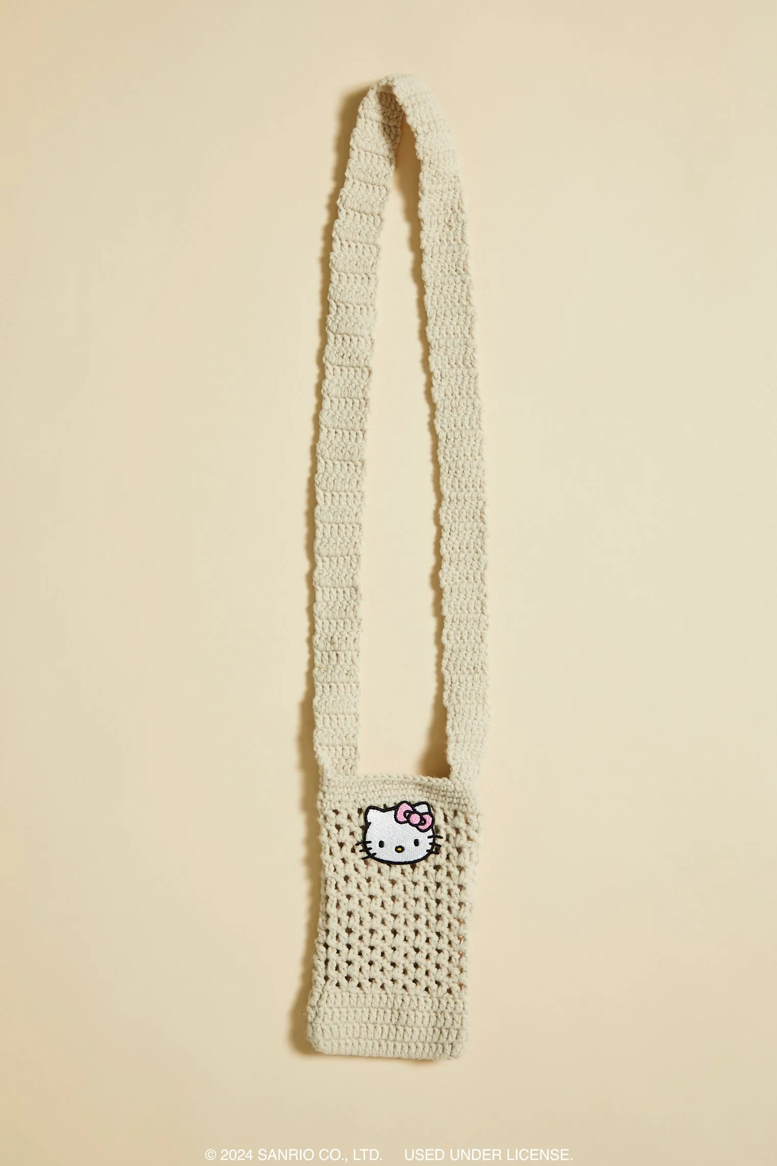 Sac à téléphone mobile crocheté à imprimé Hello Kitty sold by Urban Planet