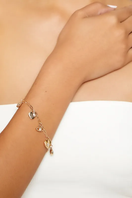 Bracelet avec breloques oeil et coeur avec pierres du Rhin sold by Urban Planet