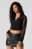 Haut corset court fleuri en dentelle à manches longues sold by Urban Planet