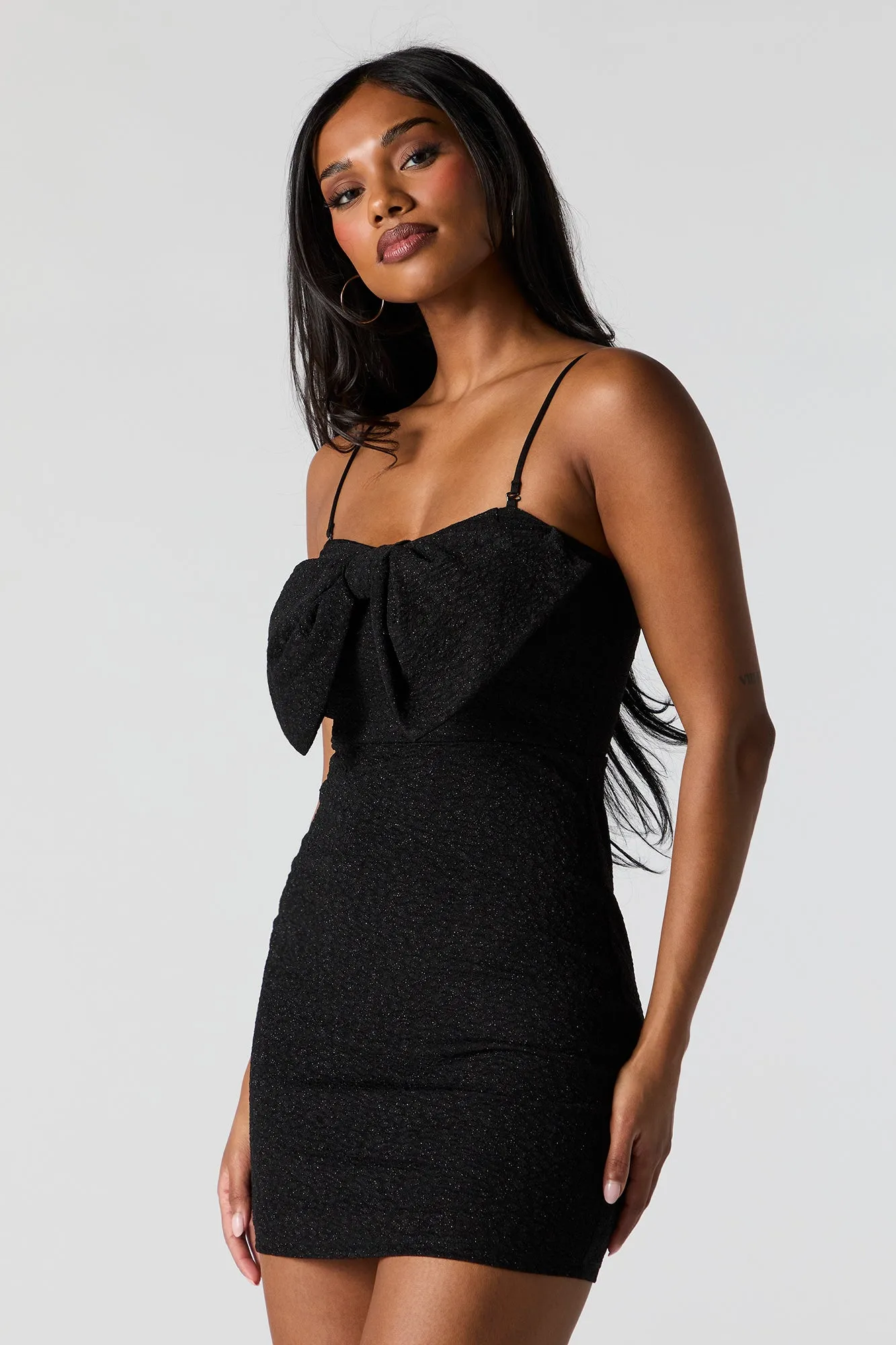 Sparkle Bow Mini Dress sold by Urban Planet