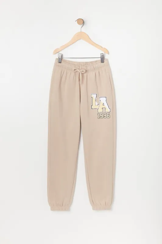 Girls LA Graphic Fleece Jogger sold by Urban Planet