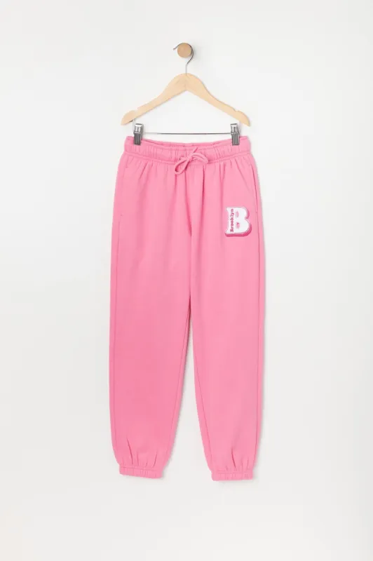 Girls Brooklyn Graphic Fleece Jogger sold by Urban Planet