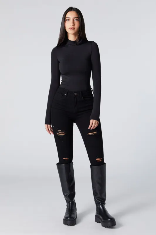 Jean remonte-fesses ajusté d'aspect usé délavé noir sold by Urban Planet