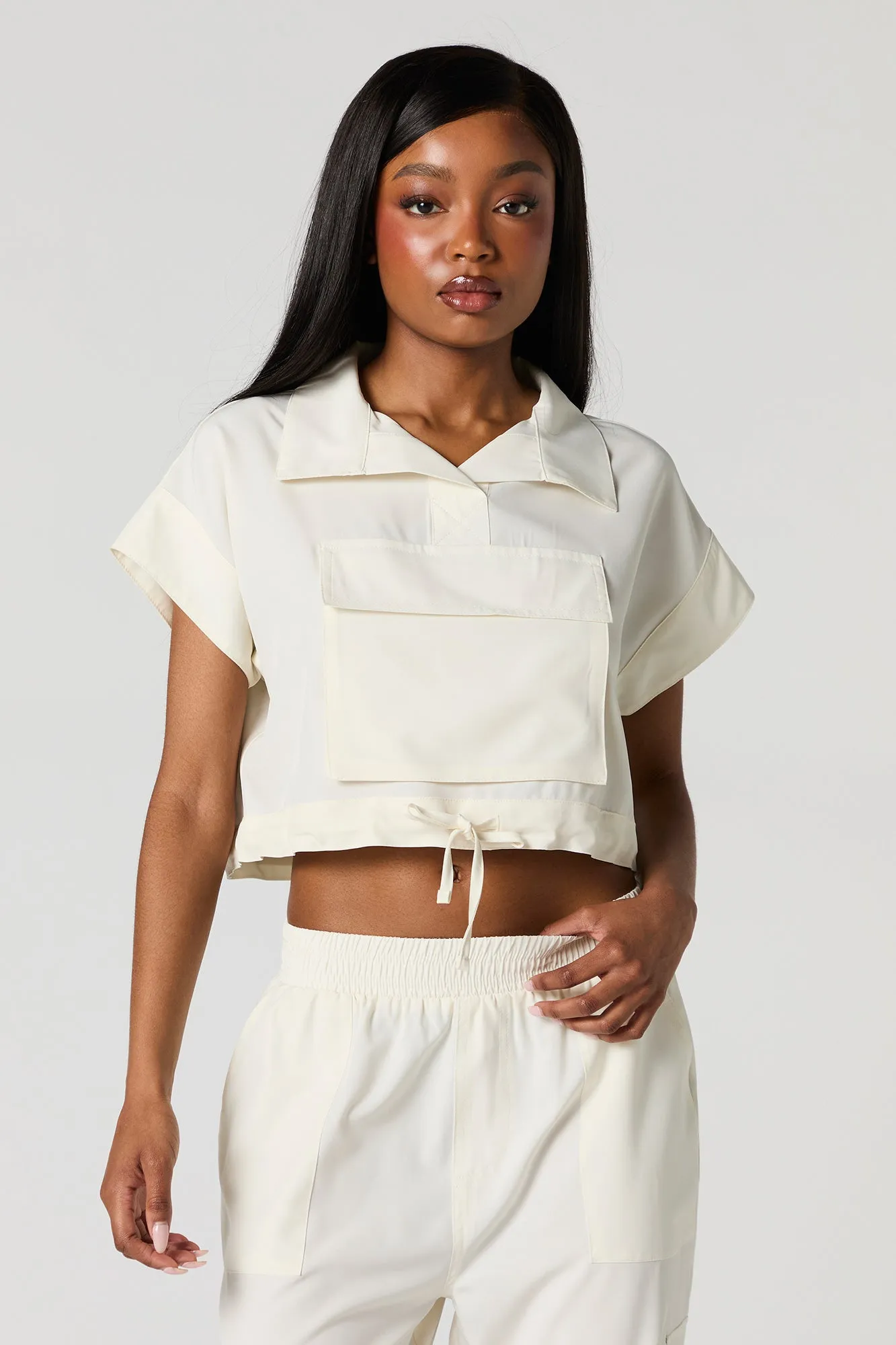 Flowy Utility Front Pocket Top sold by Urban Planet