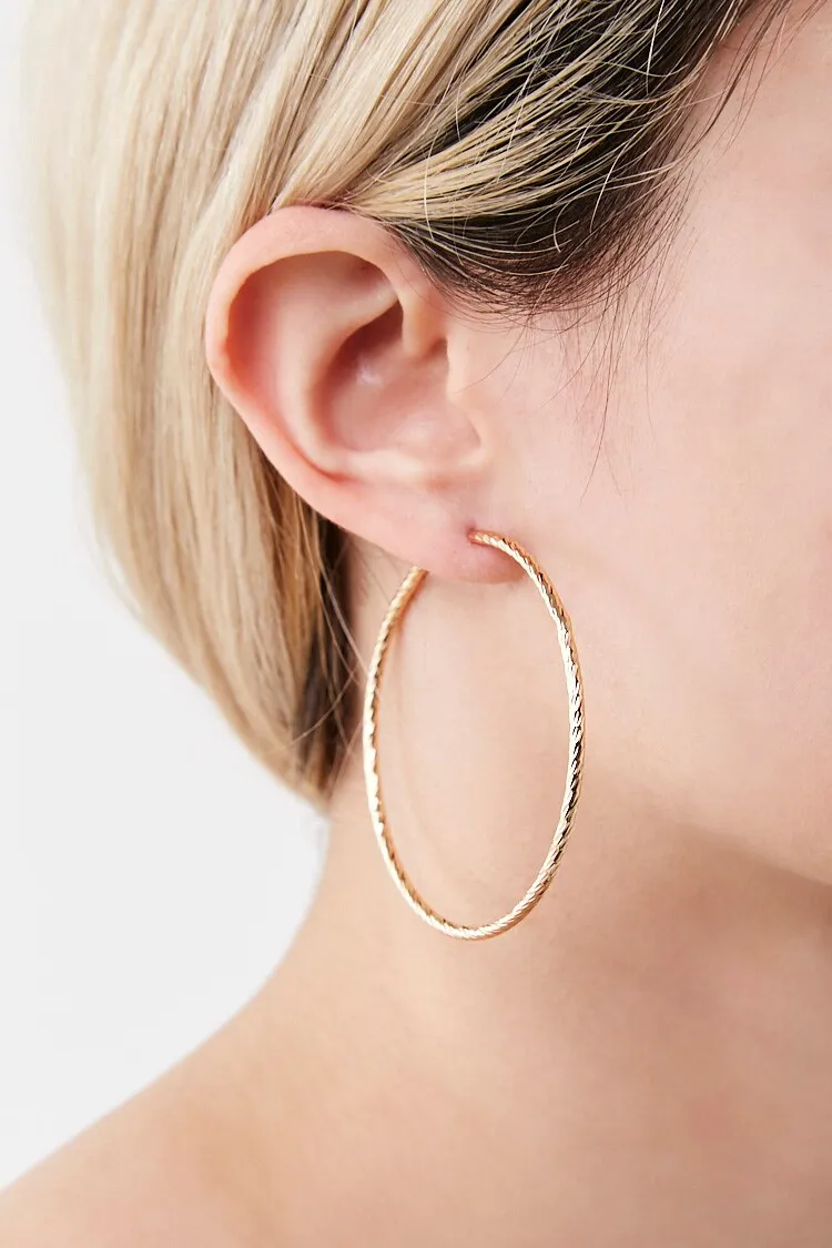 Twisted Hoop Earrings sold by Urban Planet