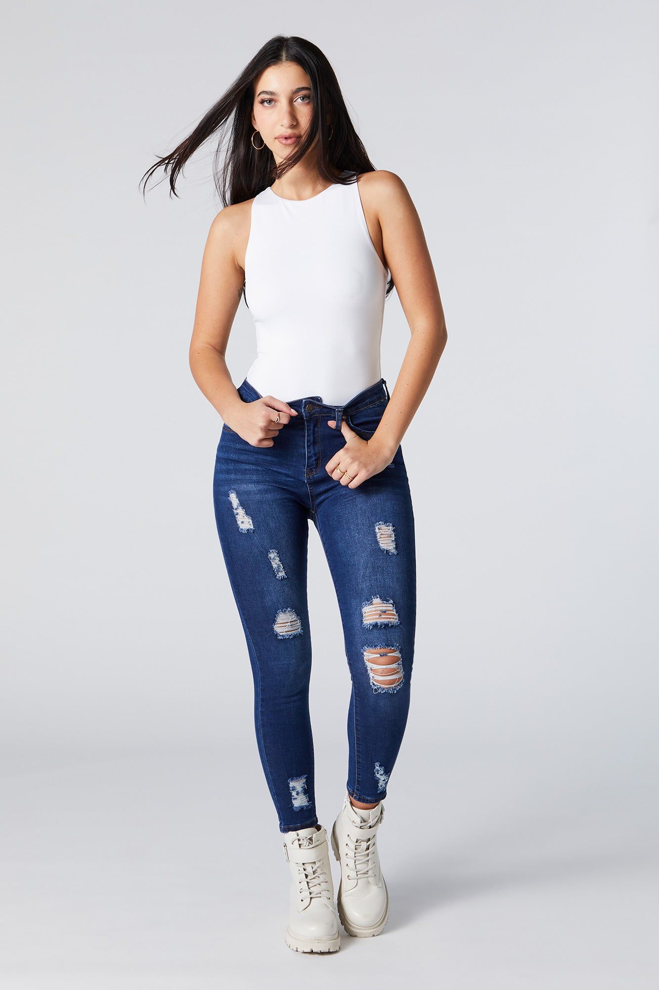 Dark Wash Distressed High Rise Skinny Jean sold by Urban Planet
