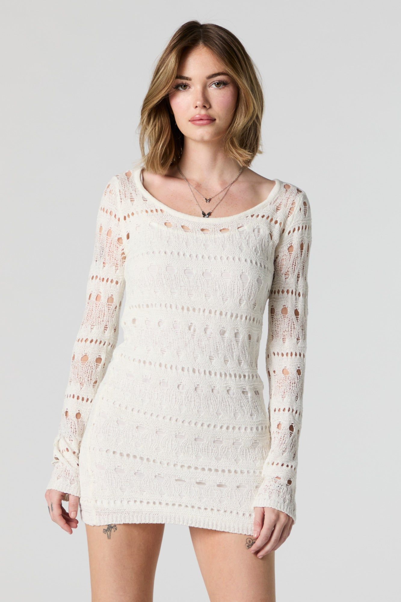 Minirobe crochetée à manches longues sold by Urban Planet