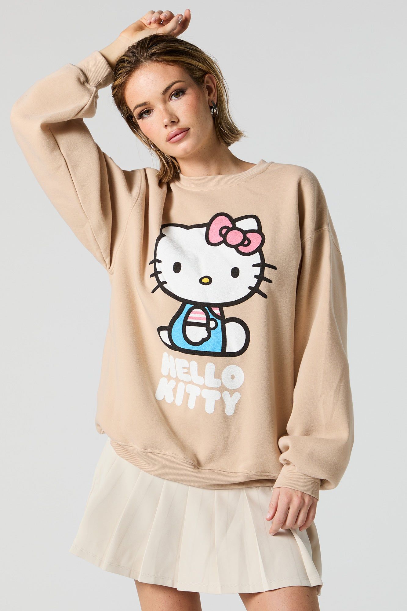 Sitting Pretty Hello Kitty Graphic Fleece Sweatshirt sold by Urban Planet