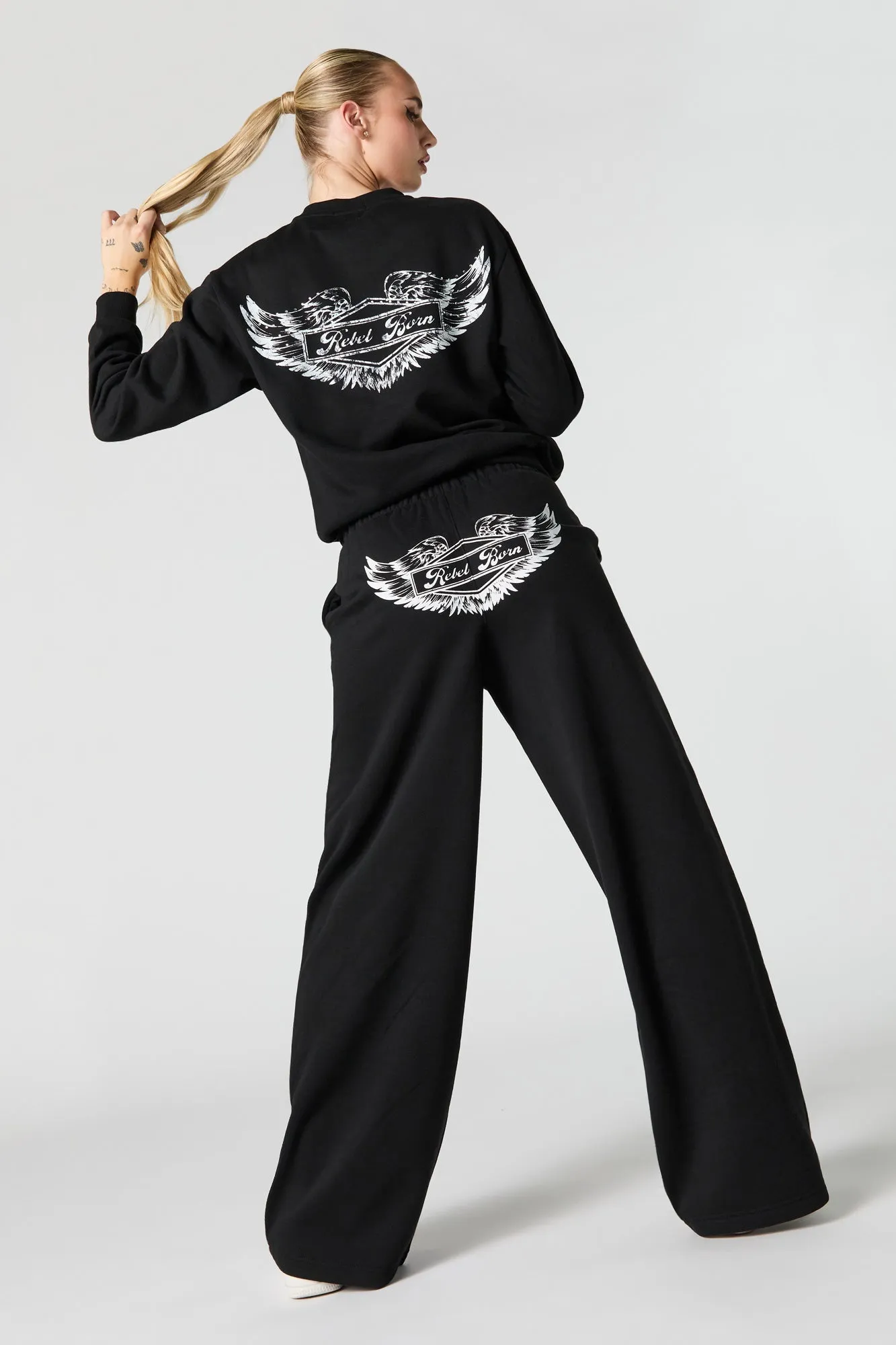Rebel Born Graphic Fleece Wide Leg Sweatpant sold by Urban Planet