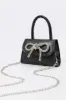Rhinestone Bow Mini Purse sold by Urban Planet