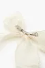 Faux Pearl Bow Hair Barrette sold by Urban Planet