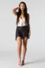 Minijupe-short asymétrique en filet sold by Urban Planet